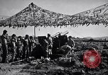 Image of U.S. Marine Battery firing 155mm howitzer Okinawa Ryukyu Islands, 1945, second 21 stock footage video 65675034734
