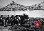 Image of U.S. Marine Battery firing 155mm howitzer Okinawa Ryukyu Islands, 1945, second 32 stock footage video 65675034734