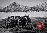 Image of U.S. Marine Battery firing 155mm howitzer Okinawa Ryukyu Islands, 1945, second 52 stock footage video 65675034734