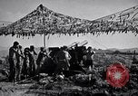 Image of U.S. Marine Battery firing 155mm howitzer Okinawa Ryukyu Islands, 1945, second 56 stock footage video 65675034734