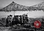 Image of U.S. Marine Battery firing 155mm howitzer Okinawa Ryukyu Islands, 1945, second 61 stock footage video 65675034734