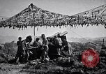 Image of U.S. Marine Battery firing 155mm howitzer Okinawa Ryukyu Islands, 1945, second 62 stock footage video 65675034734