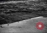 Standbild Bombardierung Okinawa Ryukyu Inseln, 1945, aus Sekunde 34 historischem Filmmaterial Videoclip 65675034736