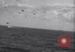 Image of Japanese kamikaze aircraft attacking US Navy ships Pacific Ocean, 1945, second 16 stock footage video 65675034755