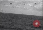 Image of Japanese kamikaze aircraft attacking US Navy ships Pacific Ocean, 1945, second 17 stock footage video 65675034755