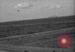 Image of Japanese kamikaze aircraft attacking US Navy ships Pacific Ocean, 1945, second 47 stock footage video 65675034755