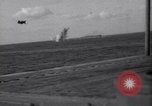 Image of Japanese kamikaze aircraft attacking US Navy ships Pacific Ocean, 1945, second 50 stock footage video 65675034755