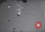 Image of Japanese kamikaze aircraft attacking US Navy ships Pacific Ocean, 1945, second 60 stock footage video 65675034755
