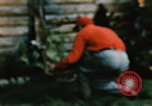 Image of Moose antlers being fastened to a log cabin Alaska USA, 1954, second 31 stock footage video 65675034930