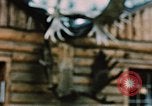 Image of Moose antlers being fastened to a log cabin Alaska USA, 1954, second 53 stock footage video 65675034930