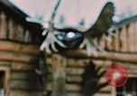 Image of Moose antlers being fastened to a log cabin Alaska USA, 1954, second 55 stock footage video 65675034930