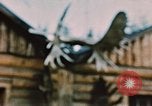 Image of Moose antlers being fastened to a log cabin Alaska USA, 1954, second 56 stock footage video 65675034930