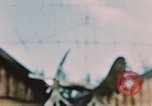 Image of Moose antlers being fastened to a log cabin Alaska USA, 1954, second 62 stock footage video 65675034930