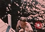 Image of bather Alaska USA, 1954, second 5 stock footage video 65675035048