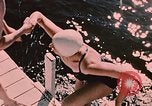 Image of bather Alaska USA, 1954, second 13 stock footage video 65675035048