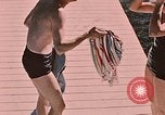 Image of bather Alaska USA, 1954, second 18 stock footage video 65675035048