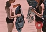 Image of bather Alaska USA, 1954, second 21 stock footage video 65675035048