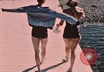 Image of bather Alaska USA, 1954, second 25 stock footage video 65675035048
