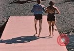 Image of bather Alaska USA, 1954, second 28 stock footage video 65675035048