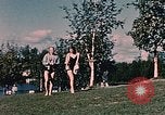 Image of bather Alaska USA, 1954, second 52 stock footage video 65675035048