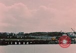 Image of Cranes and buildings near Knik Arm Cook Inlet  Anchorage Alaska USA, 1953, second 7 stock footage video 65675035068