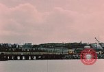 Image of Cranes and buildings near Knik Arm Cook Inlet  Anchorage Alaska USA, 1953, second 8 stock footage video 65675035068