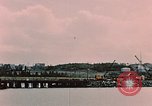 Image of Cranes and buildings near Knik Arm Cook Inlet  Anchorage Alaska USA, 1953, second 9 stock footage video 65675035068