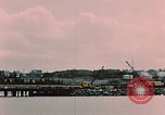 Image of Cranes and buildings near Knik Arm Cook Inlet  Anchorage Alaska USA, 1953, second 14 stock footage video 65675035068