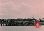 Image of Cranes and buildings near Knik Arm Cook Inlet  Anchorage Alaska USA, 1953, second 16 stock footage video 65675035068