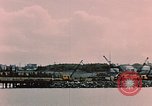 Image of Cranes and buildings near Knik Arm Cook Inlet  Anchorage Alaska USA, 1953, second 18 stock footage video 65675035068