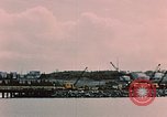 Image of Cranes and buildings near Knik Arm Cook Inlet  Anchorage Alaska USA, 1953, second 19 stock footage video 65675035068