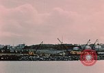 Image of Cranes and buildings near Knik Arm Cook Inlet  Anchorage Alaska USA, 1953, second 25 stock footage video 65675035068
