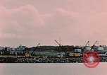 Image of Cranes and buildings near Knik Arm Cook Inlet  Anchorage Alaska USA, 1953, second 27 stock footage video 65675035068