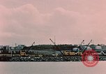 Image of Cranes and buildings near Knik Arm Cook Inlet  Anchorage Alaska USA, 1953, second 29 stock footage video 65675035068