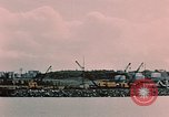 Image of Cranes and buildings near Knik Arm Cook Inlet  Anchorage Alaska USA, 1953, second 30 stock footage video 65675035068