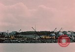 Image of Cranes and buildings near Knik Arm Cook Inlet  Anchorage Alaska USA, 1953, second 31 stock footage video 65675035068