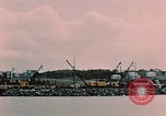 Image of Cranes and buildings near Knik Arm Cook Inlet  Anchorage Alaska USA, 1953, second 32 stock footage video 65675035068