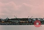 Image of Cranes and buildings near Knik Arm Cook Inlet  Anchorage Alaska USA, 1953, second 35 stock footage video 65675035068
