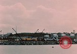 Image of Cranes and buildings near Knik Arm Cook Inlet  Anchorage Alaska USA, 1953, second 41 stock footage video 65675035068