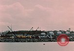 Image of Cranes and buildings near Knik Arm Cook Inlet  Anchorage Alaska USA, 1953, second 43 stock footage video 65675035068