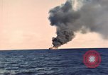 Image of ship burns Saipan Northern Mariana Islands, 1944, second 61 stock footage video 65675035298