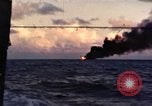 Image of ships burn Saipan Northern Mariana Islands, 1944, second 1 stock footage video 65675035299