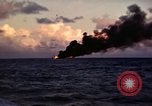 Image of ships burn Saipan Northern Mariana Islands, 1944, second 7 stock footage video 65675035299