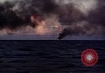 Image of ships burn Saipan Northern Mariana Islands, 1944, second 12 stock footage video 65675035299