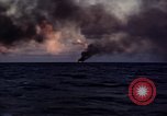 Image of ships burn Saipan Northern Mariana Islands, 1944, second 14 stock footage video 65675035299