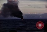 Image of ships burn Saipan Northern Mariana Islands, 1944, second 18 stock footage video 65675035299