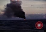 Image of ships burn Saipan Northern Mariana Islands, 1944, second 21 stock footage video 65675035299