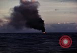 Image of ships burn Saipan Northern Mariana Islands, 1944, second 22 stock footage video 65675035299