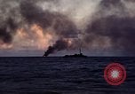 Image of ships burn Saipan Northern Mariana Islands, 1944, second 24 stock footage video 65675035299