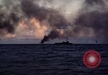 Image of ships burn Saipan Northern Mariana Islands, 1944, second 25 stock footage video 65675035299